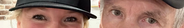 Brooke, founder of Do Hard Stuff, smiling beside her father wearing matching motivational hats that say "Do Hard Stuff Every Day" and "No Quit"