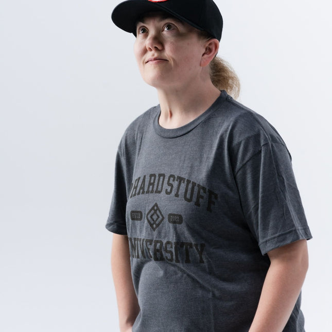 Full front-facing image of model wearing the Do Hard Stuff Alma Mater tee