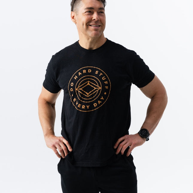 Do Hard Stuff Every Day tee with front circular logo, black shirt