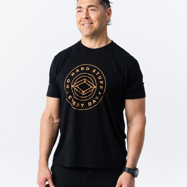 Full body shot of model wearing Do Hard Stuff Every Day tee