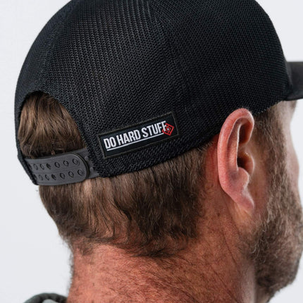 Detailed view of Do Hard Stuff branding on back of GRIT Hat – motivational camo snapback
