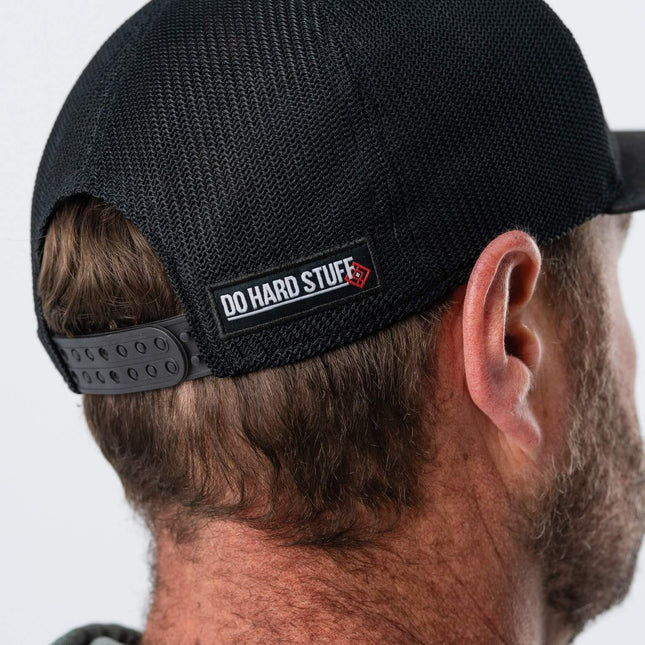 Detailed view of Do Hard Stuff branding on back of GRIT Hat – motivational camo snapback