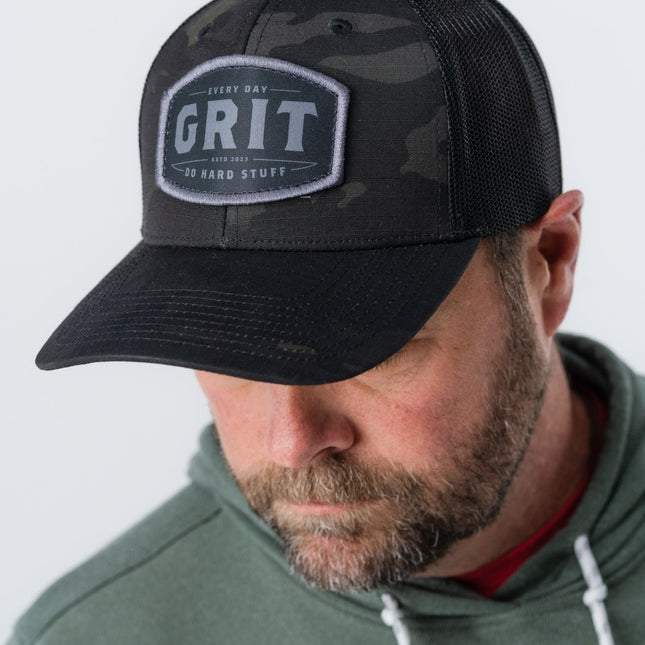 Side profile of man in Do Hard Stuff GRIT Hat – motivational camo hat