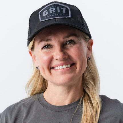 Woman wearing Do Hard Stuff GRIT Hat in Magic Camo – empowering everyday apparel