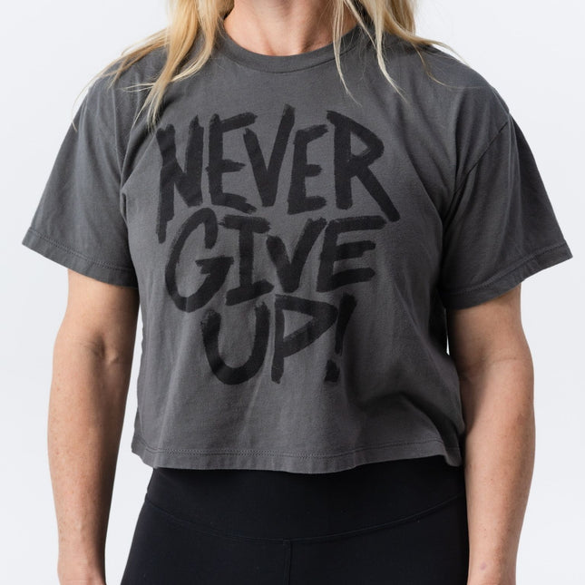 Do Hard Stuff crop tee with Never Give Up message shown from slight angle