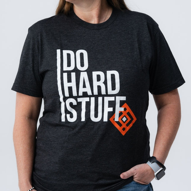 Side angle of woman in Do Hard Stuff Mantra Tee looking left